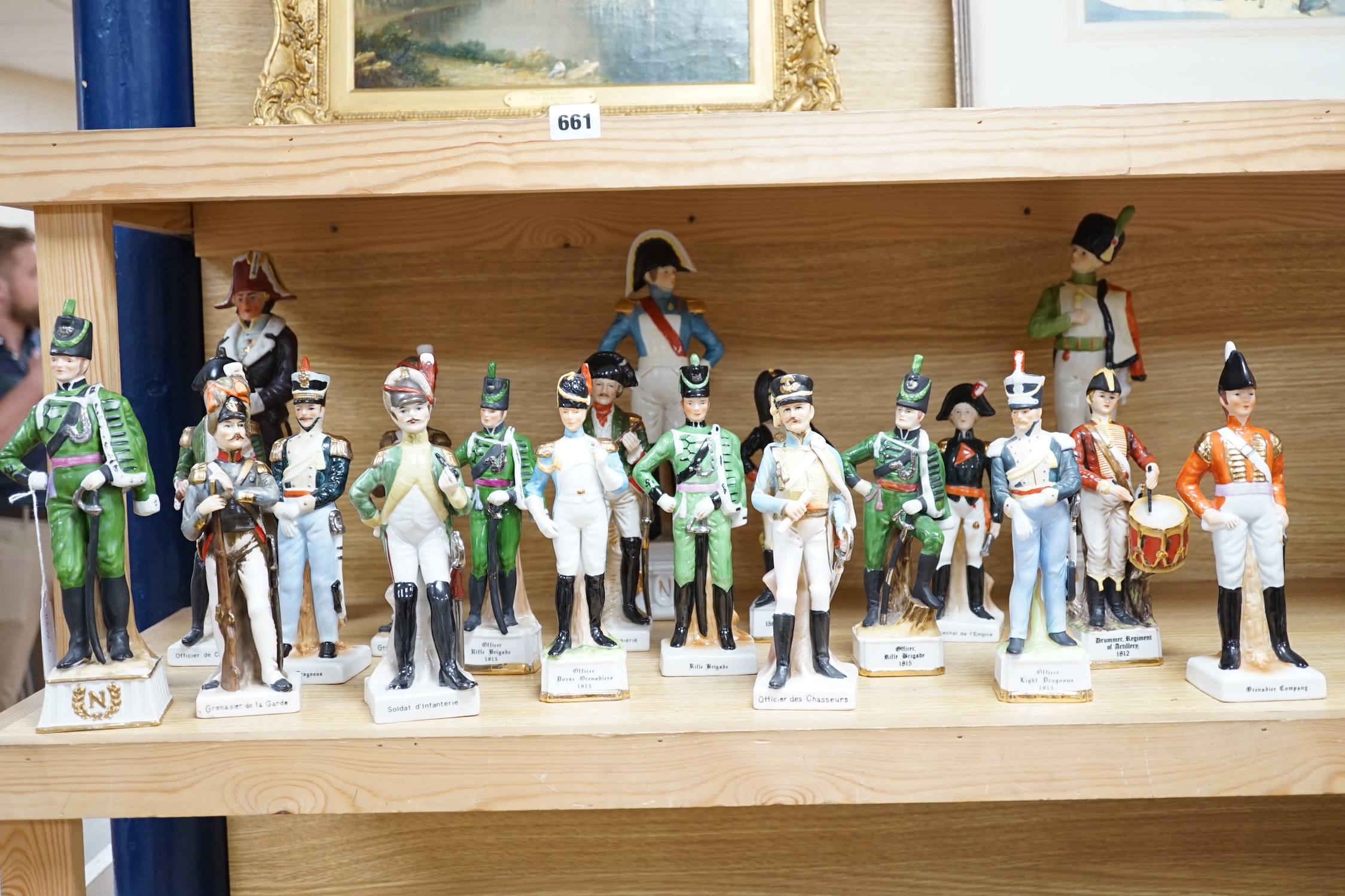 Twenty porcelain figures of soldiers including Officer Light Dragoon and Rifle Brigade, largest 31cm high